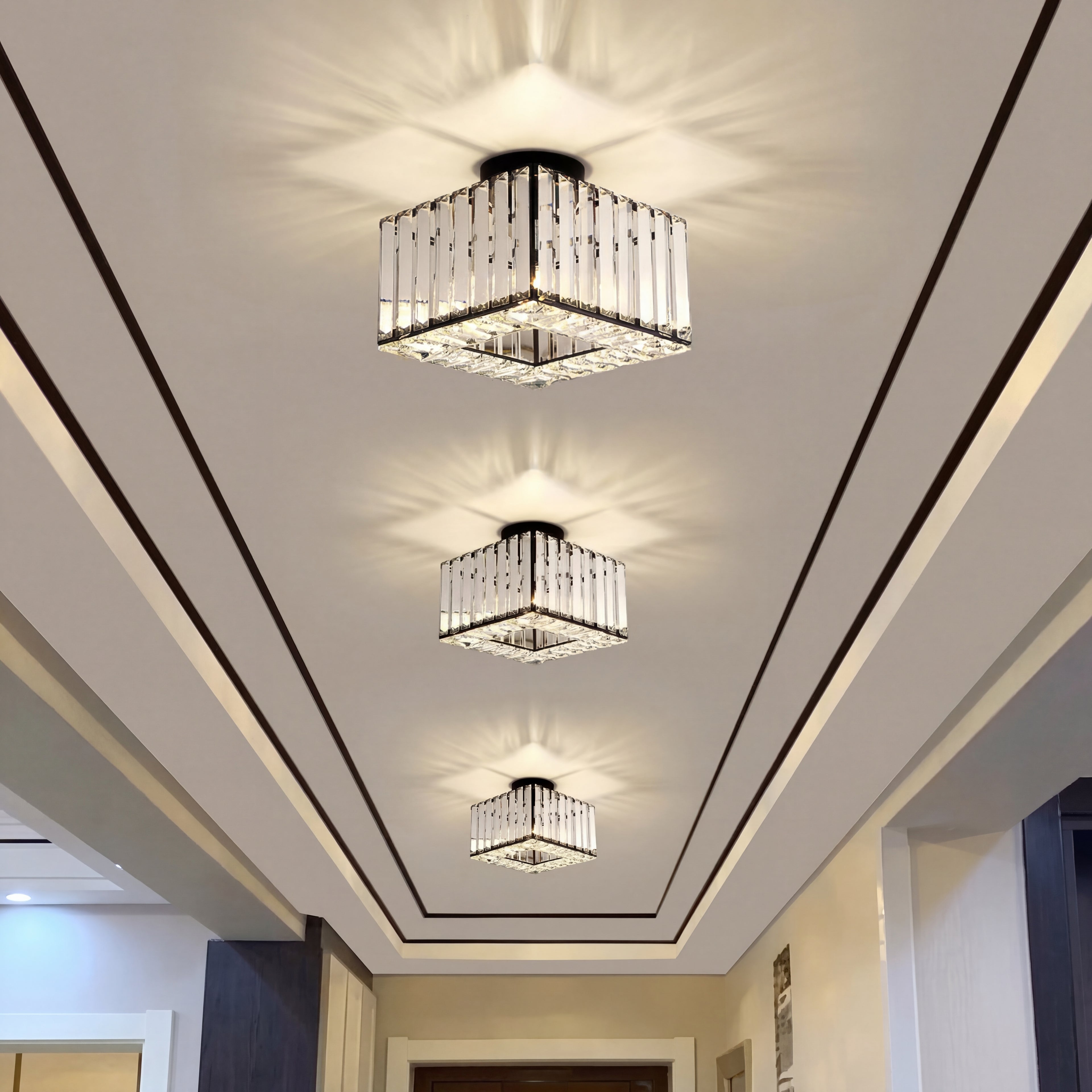 Gold-colored The Baccarat Light by Glow Reflect featuring a modern geometric design on a sleek surface.